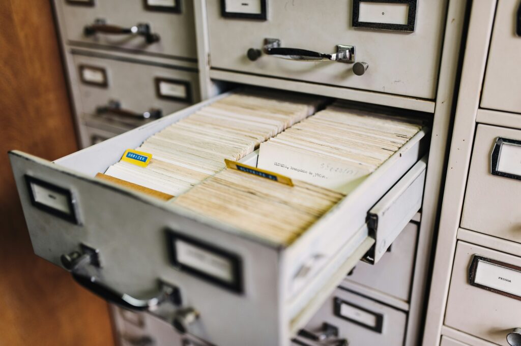 An open filing drawer with labelled folders